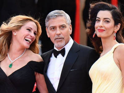 Clooney conteso tra Amal e Julia sul red carpet di Cannes