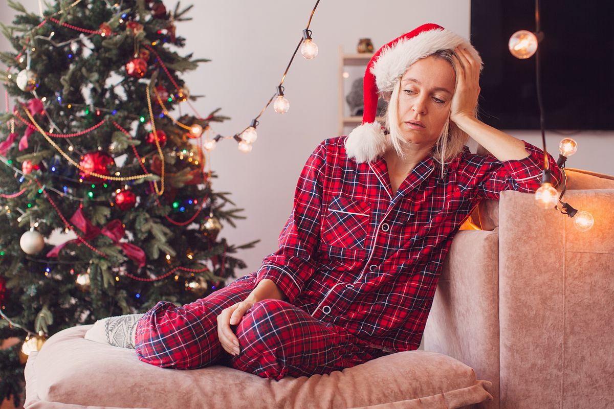 donna stanca natale luci albero